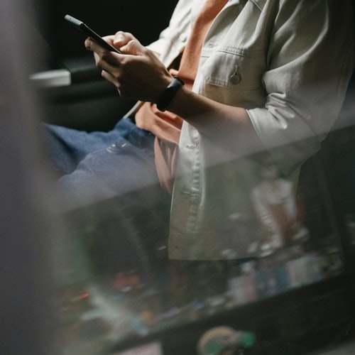 Comfort and Space - Person travelling with phone